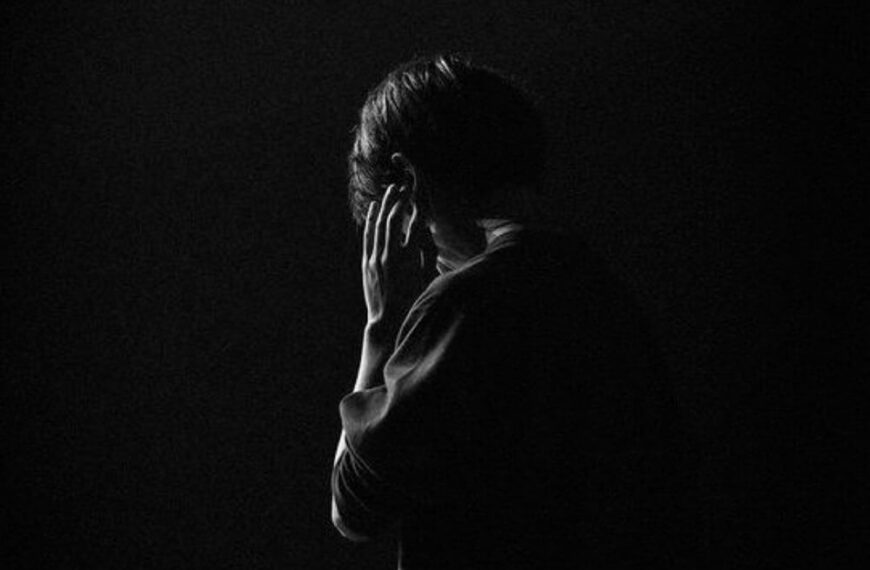man is stand in night with sadness